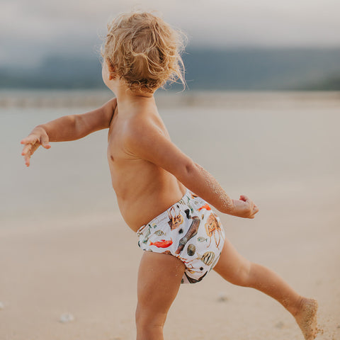 Kaleimamo Nā Iʻa ʻOno Ē cloth diaper baby on beach