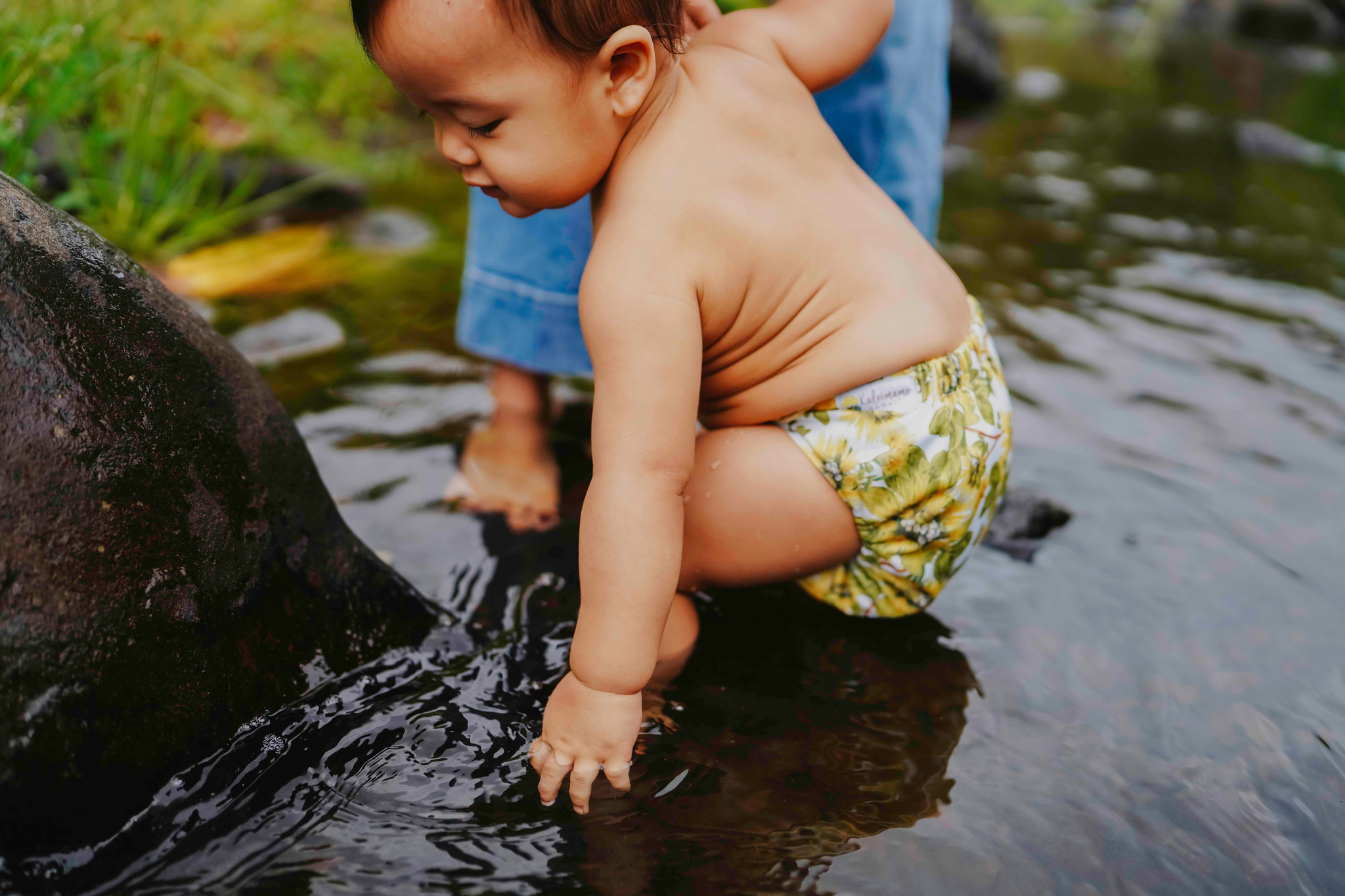 Baby in river Kaleimamo hawaiʻi cloth diaper Lehua Mamo